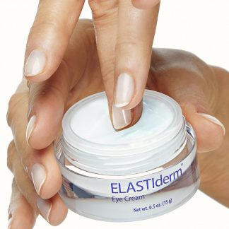 elastiderm eye cream pot in hand